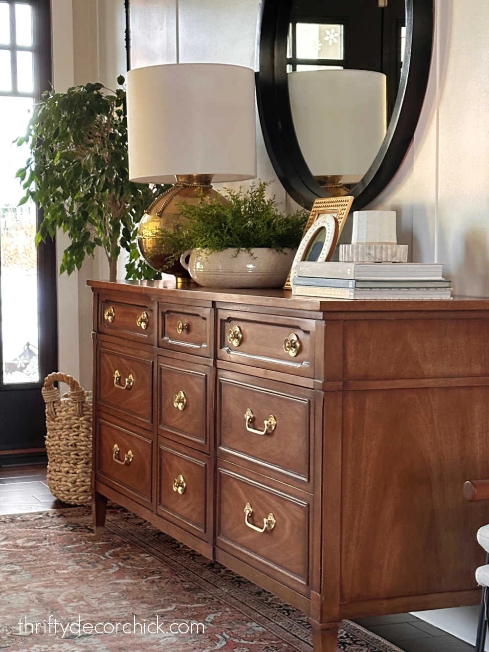 brass lamp on wood dresser